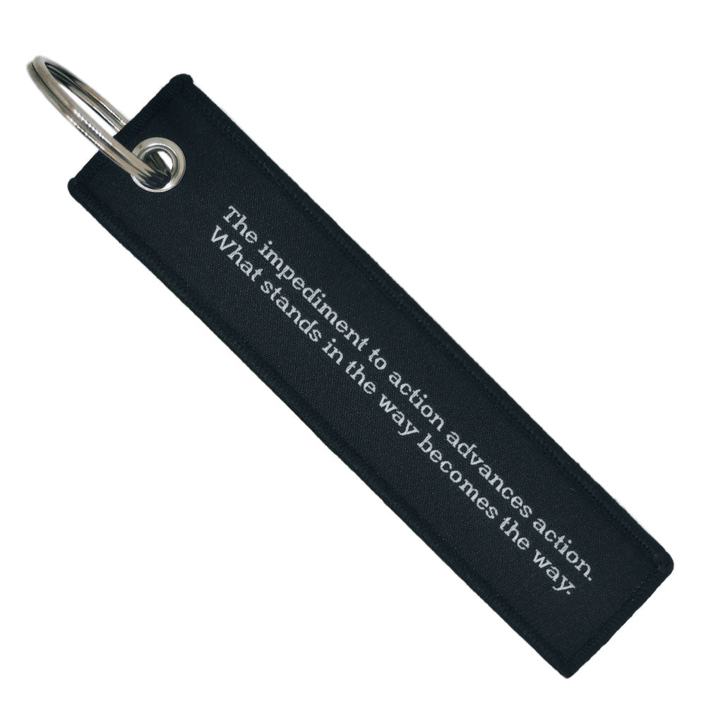 Double-sided embroidered Fabric Keychain with the obstacle is the way Phrase 13 x 3 cm