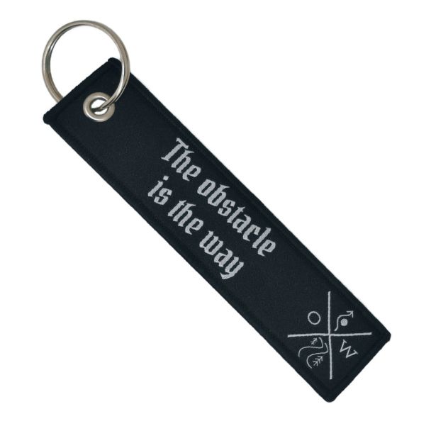 Double-sided embroidered Fabric Keychain with the obstacle is the way Phrase 13 x 3 cm